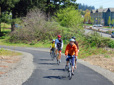 People riding bicycles on a path in Gresham
