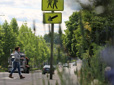 Cars and pedestrian on road in Gresham