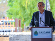 Senator Merkley at podium addressing a crowd at a groundbreaking event. 