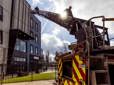 Firefighters descending a ladder