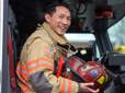 Gresham firefighter seated in a fire truck