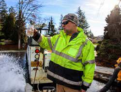 City of Gresham employee performing water flushing