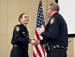 Officer shaking hands with the Chief of Police at during Oath of Office ceremony.