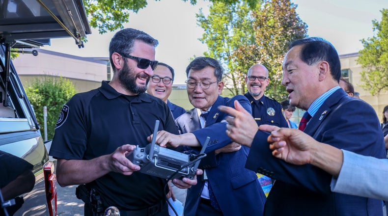 Guests from Sokcho watch a drone demonstration by Gresham Police during their visit to City Hall on July 18.