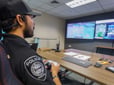Officer piloting a drone from the command center.