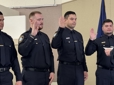 Four officers taking the Oath of Office.