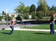 People standing on grassy lawn at Arts Plaza