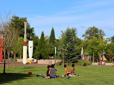 People having a picnic on lawn at Arts Plaza