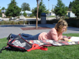 Person lying on lawn at Arts Plaza