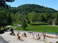 Play structure, paths, lawn and trees at Main City Park