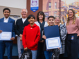 Three kids honored with Rising Star Awards stand with City Council. 